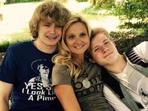 Meet Jan Tiffany where she sits on a bench happily with her two blonde boys