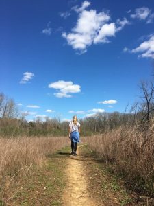 Meet Jan Tiffany on a walk down a dirt path with carolina blue skies above