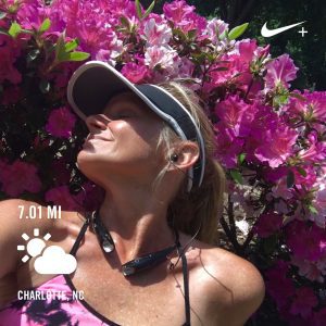 Meet Jan Tiffany on a run after 7 miles in front of flowers