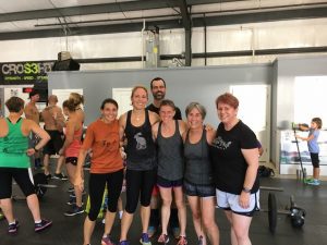 A group of ladies posing after a Crossfit competition