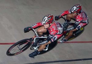 FiTness Testimony from a Professional Athlete, two cyclists in a race in red cycling gear