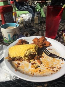 Clean Eating at Charlotte's Famous Zeda Jane's Restaurant, a picture of a big breakfast, egg omelette stuffed with tons of meat and cheese with sweet potatoes on the side