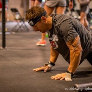 Suffering Over Sin, a CrossFit guy with a bandana on doing a burpee