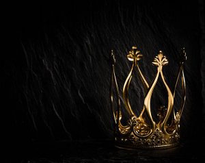 7 Bible Verses to Motivate You to Exercise, gold crown sitting in the dark, dramatic