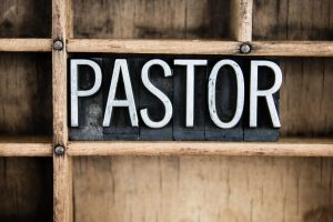 What Pastors Are Saying About Starting Their Journey Into The ReStart Your Heart Program, the word pastor on a chalkboard with wood rustic background