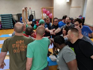 Pastors Find Success in ReStart Your Heart Wellness Program, group with all hands in