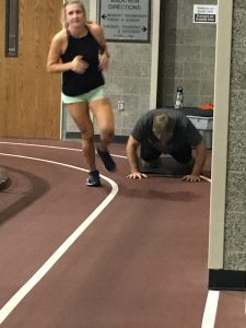 6 Things Soldiers and Pastors Have in Common, Amy running on the track with a black tank top on