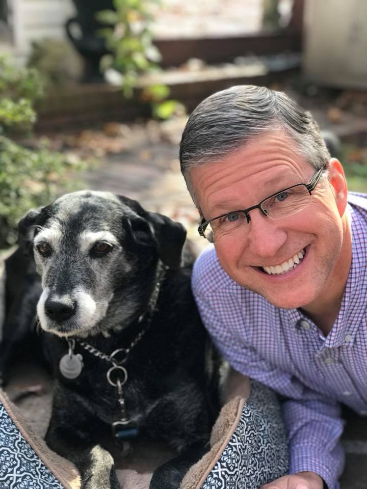 A Joyfully FiT Leader - Jay Hancock, Jay smiling with his dog