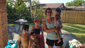 Meet Ministry Leader, Laura, Who's Goal is Longevity!, Laura with all her kids at a pool party