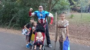 Church at Charlotte's, Nic Schrieber, Inspires All to Take Action on Their Health, Nic in a superhero costume with his kids