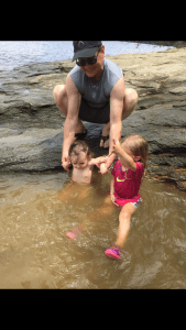Kenny K. - A Shepherd Who Cares, Kenny dipping his grandbaby in the water