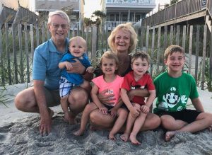 Testimonial Tuesday -Jackie Lawing, Jackie smiling with all her grandbabies at the beach.