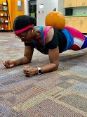Our Victorious Vinita Simmons, planking with a pumpkin on her back