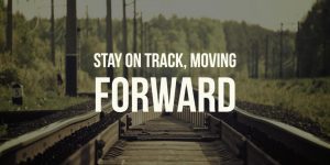 Stay on Track Move Forward with railroad tracks in background