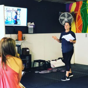 Sara teaching pelvic floor function to MissionFiT women athletes during Pelvic Floor Night - Women's Health Series #1